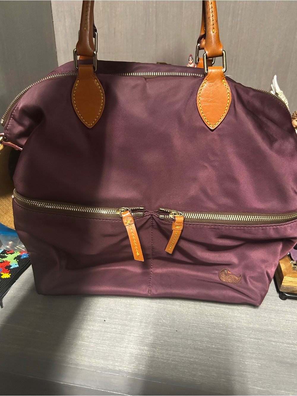 Dooney & Bourke Plum Duffel with Tan Leather Trim